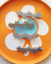 Load image into Gallery viewer, A selection of Bess hair clips, handmade resin hair clips in the shape of 5 stars.
